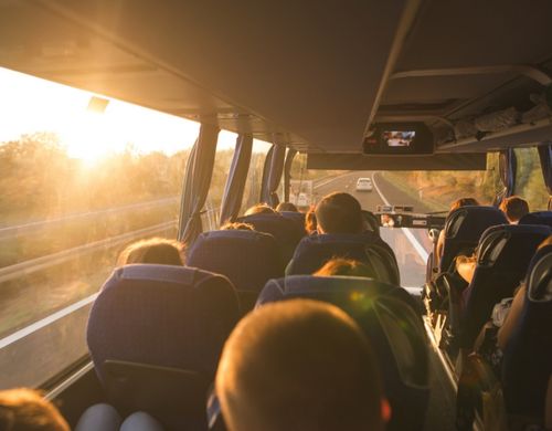 large charter bus filled with people on a trip